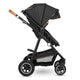 Carucior 3 in 1, Lionelo, Amber, Cadru aluminiu, Cu landou intarit si salteluta moale, Cu scoica auto testata ADAC, Reversibil, Cu accesorii, Geanta parinti, Pana la 22 kg, Gri Inchis