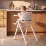 Scaun de masa multifunctional Celia Close&Cosy, Lionelo, Din lemn de fag, 6 luni- adult, Reglabil pe inaltime, Spatar lat, Sezut ergonomic, Tavita silicon, Suport de picioare reglabil, Greutate maxima 90 Kg, Alb